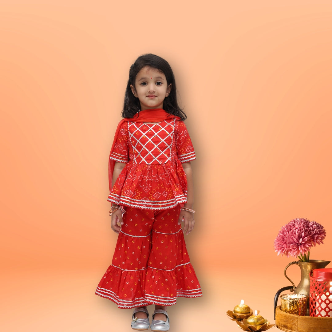 Girl wearing red cotton bandhani sharara set with dupatta – Tippy Top ethnic wear