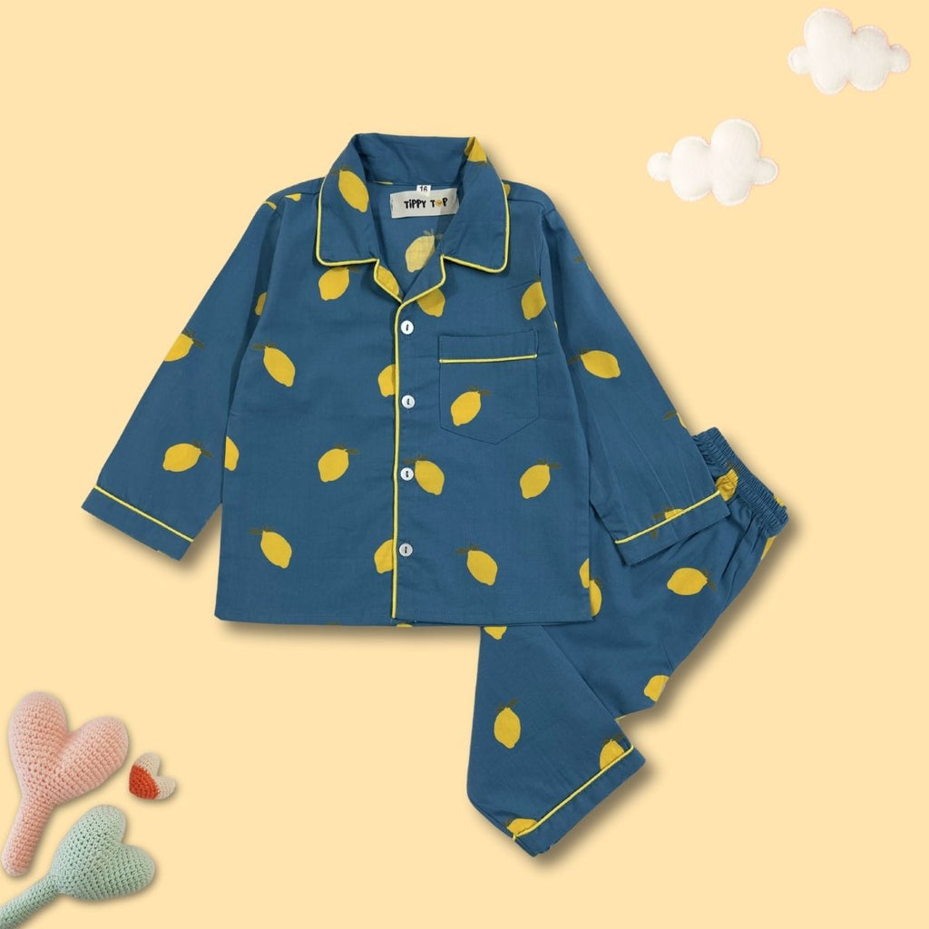 Blue pajama set with yellow lemon pattern on a beige background