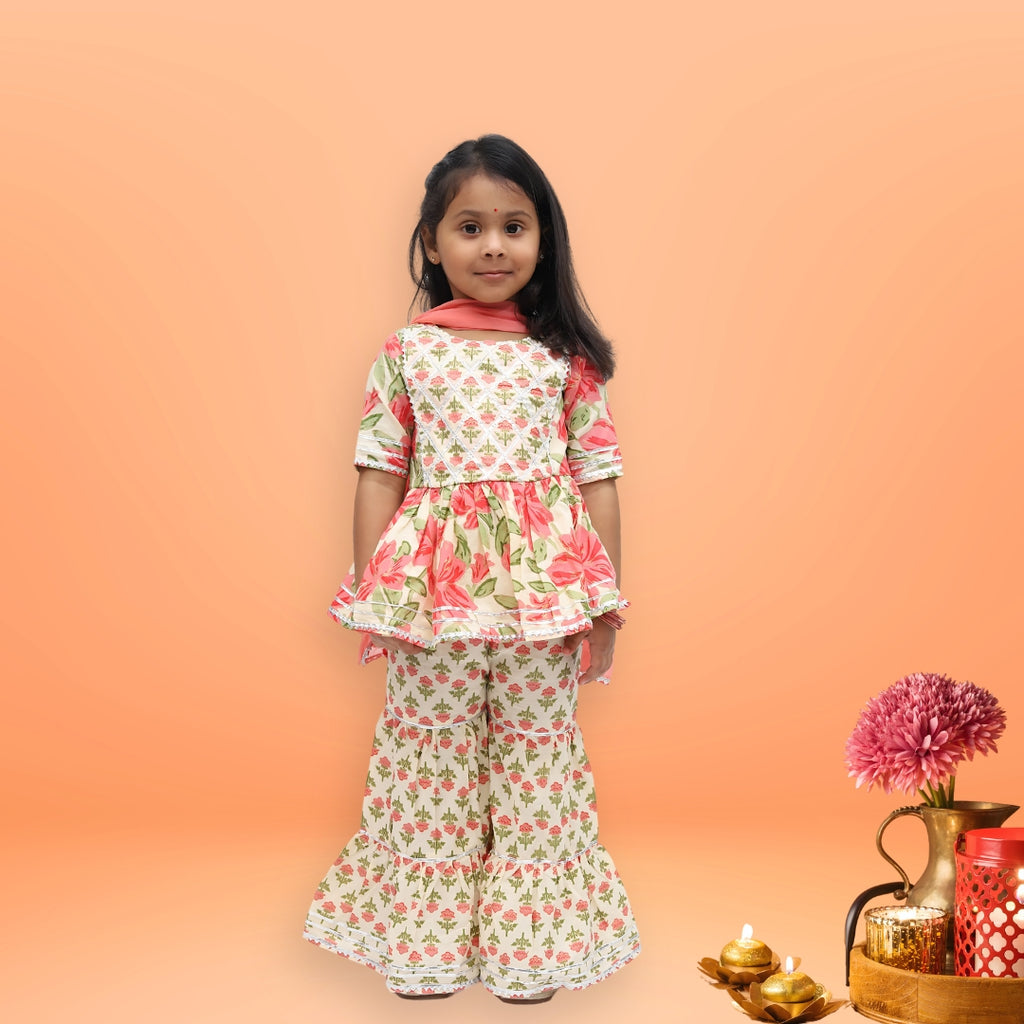 Girls festive wear – cream cotton floral sharara set with bold pink motifs and lace detailing