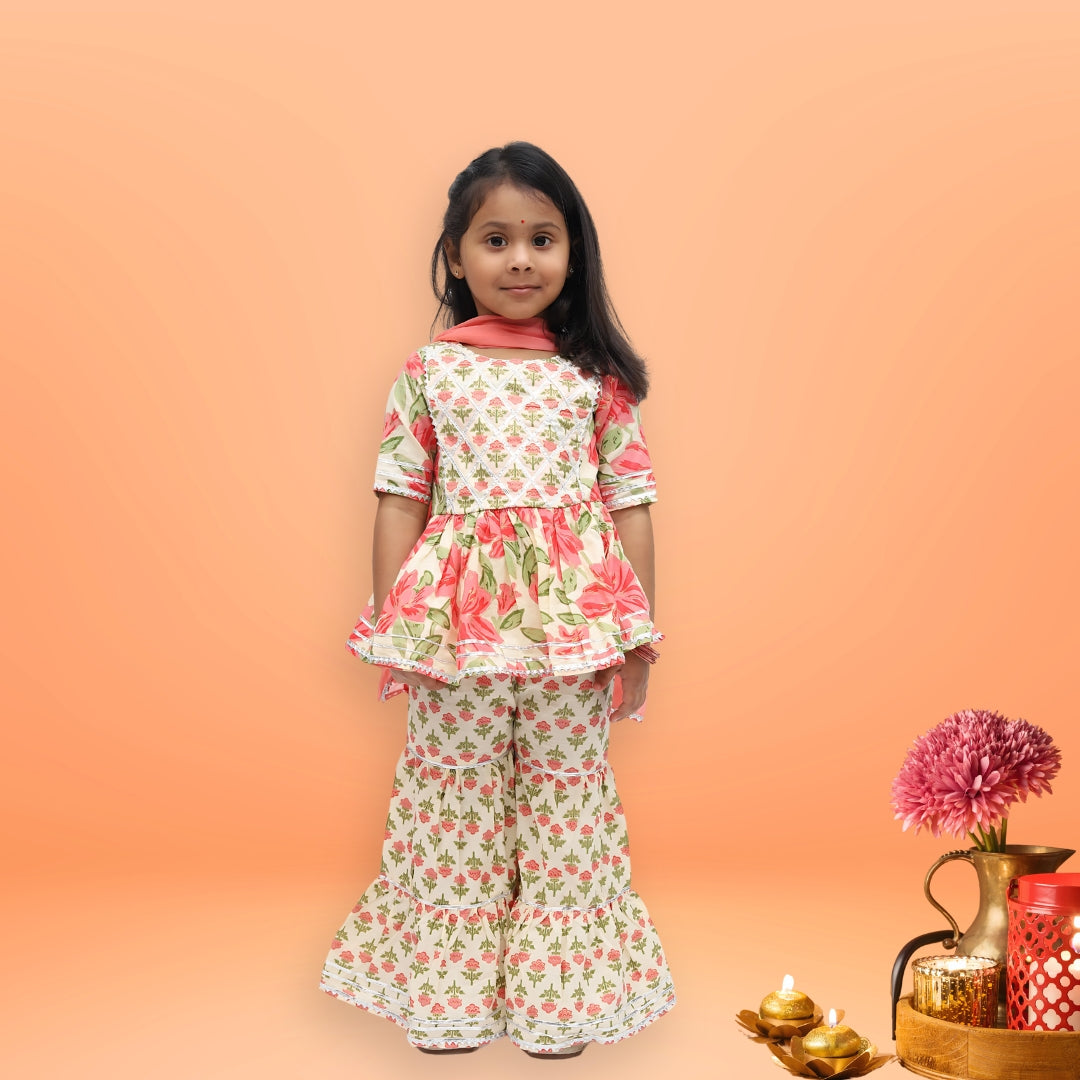 Girls festive wear – cream cotton floral sharara set with bold pink motifs and lace detailing