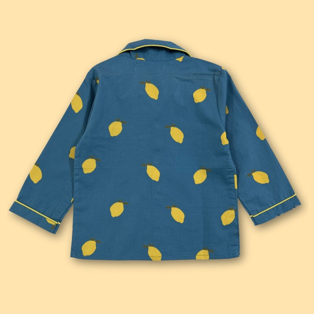 Blue jacket with yellow lemon pattern on a beige background