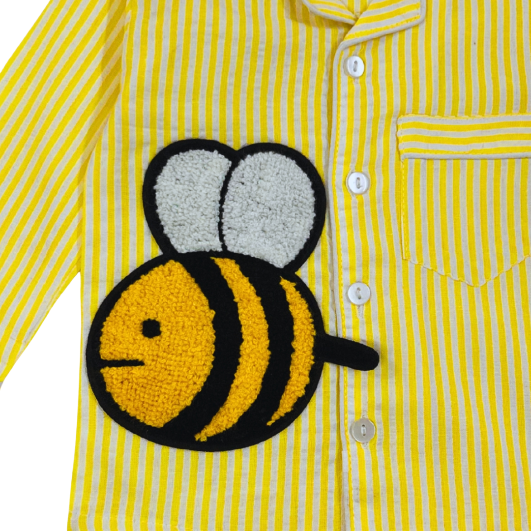 Yellow striped shirt with a bee patch on a white background