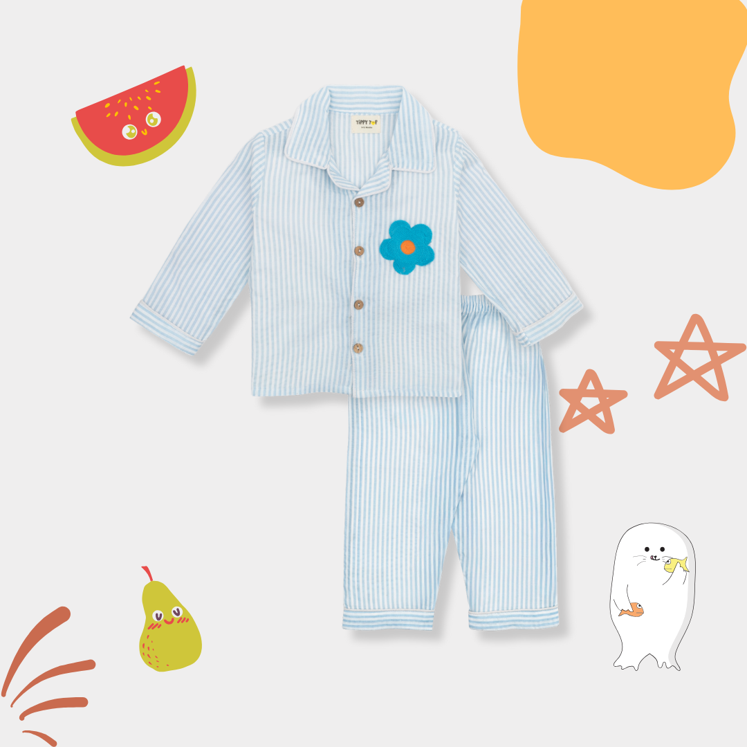 Children's blue striped pajama set with a flower design on a colorful background