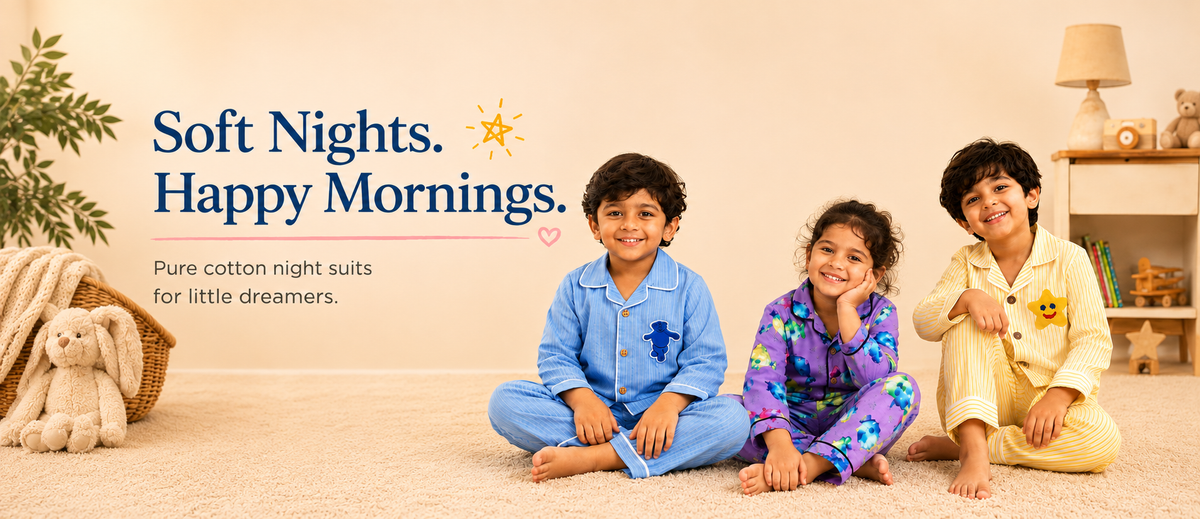 3 kids wearing Tippy Top Night suits sitting on floor in an aesthtic setup