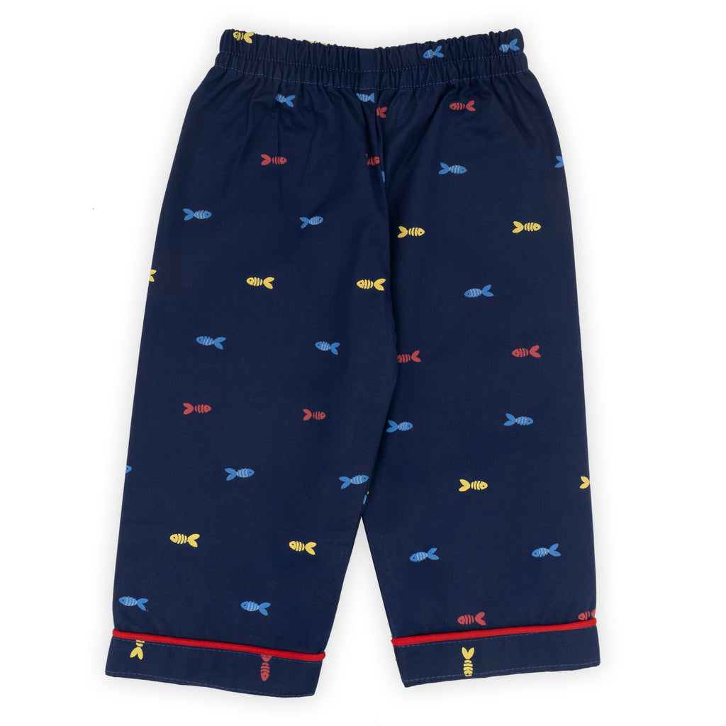 Navy blue children's pajama pants with colorful fish pattern on a white background