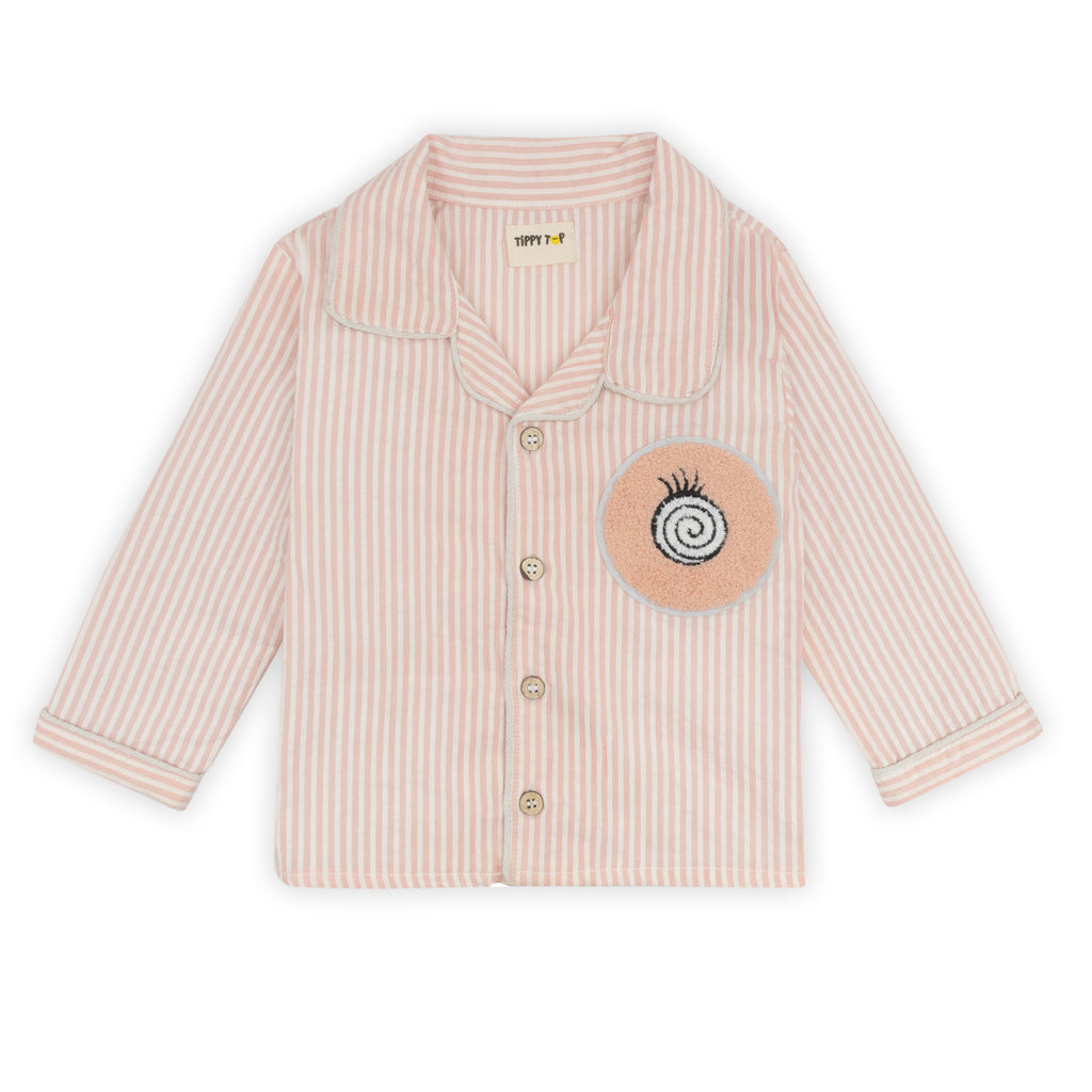 Beige striped shirt with a circular patch on a white background