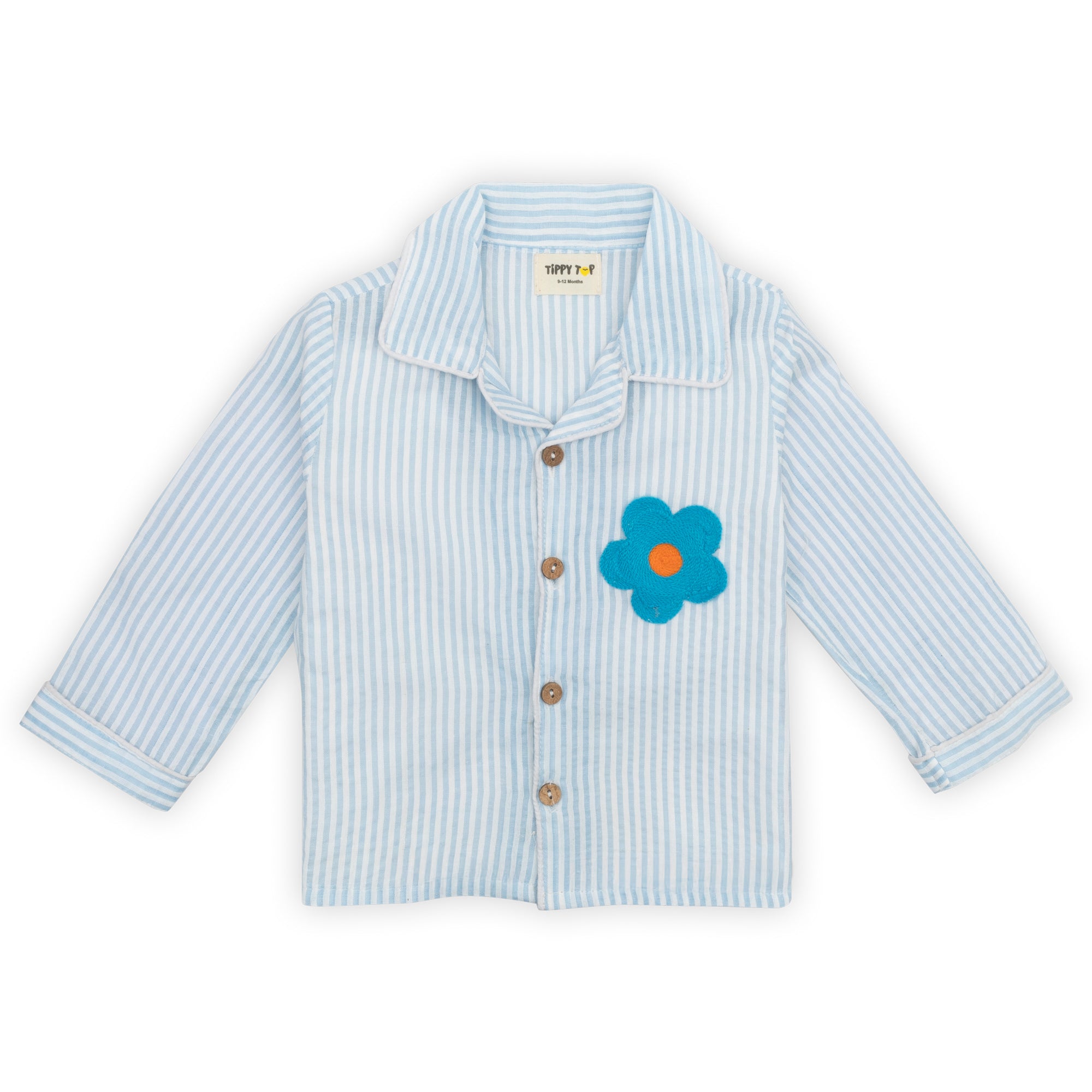Children's light blue striped shirt with a floral button on a white background