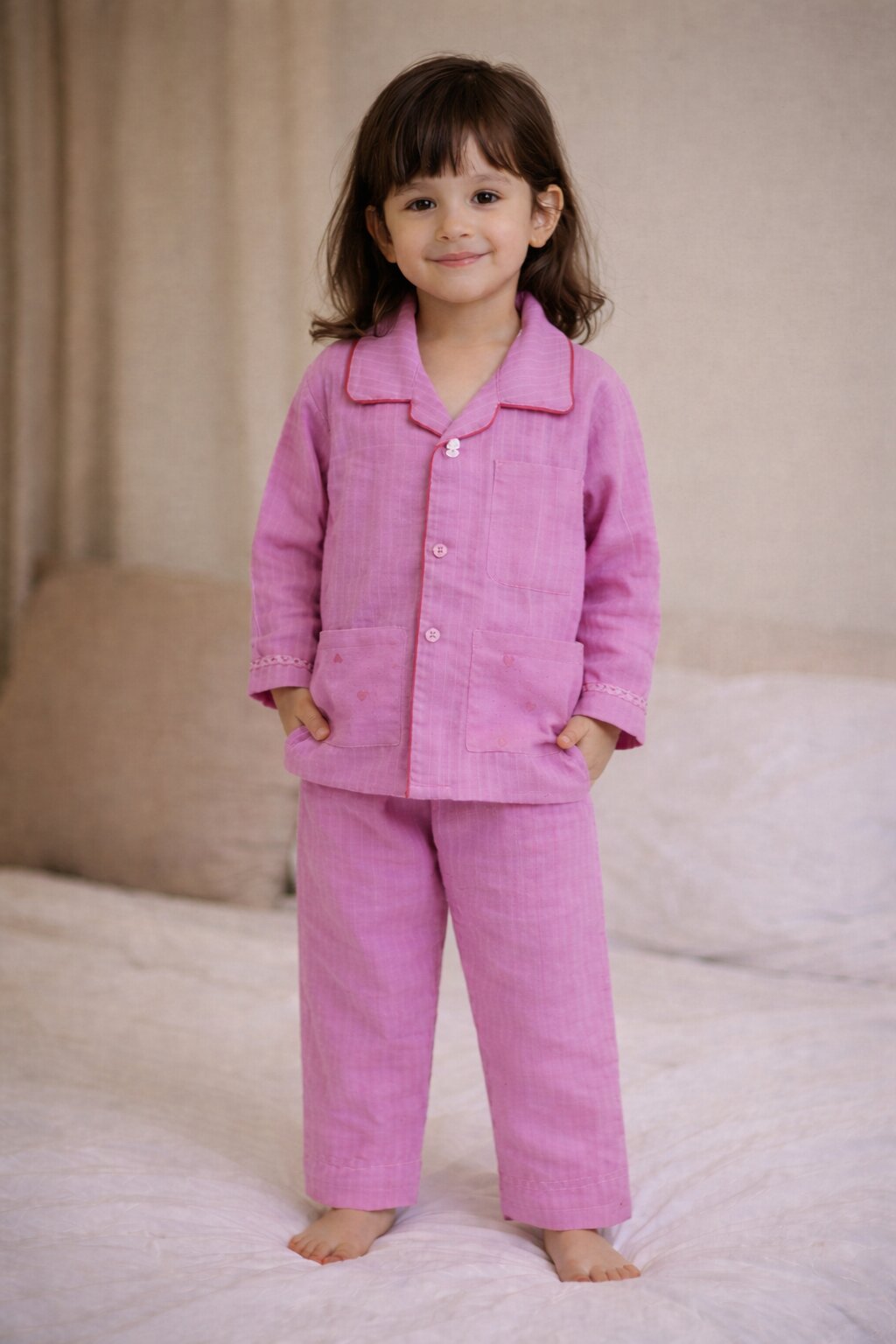 Girls pink cotton night suit with heart pocket detail – front view