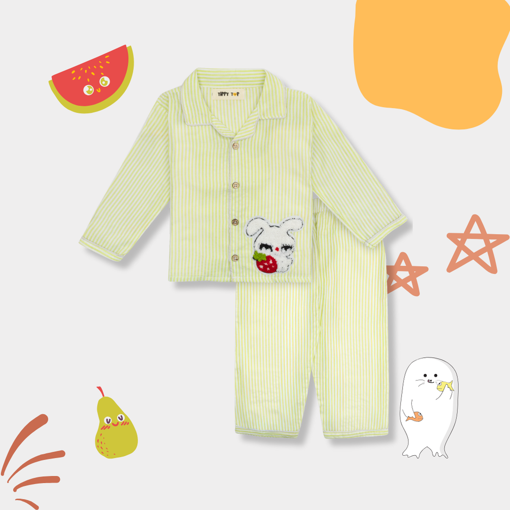 Children's green striped pajama set with cartoon character on a white background