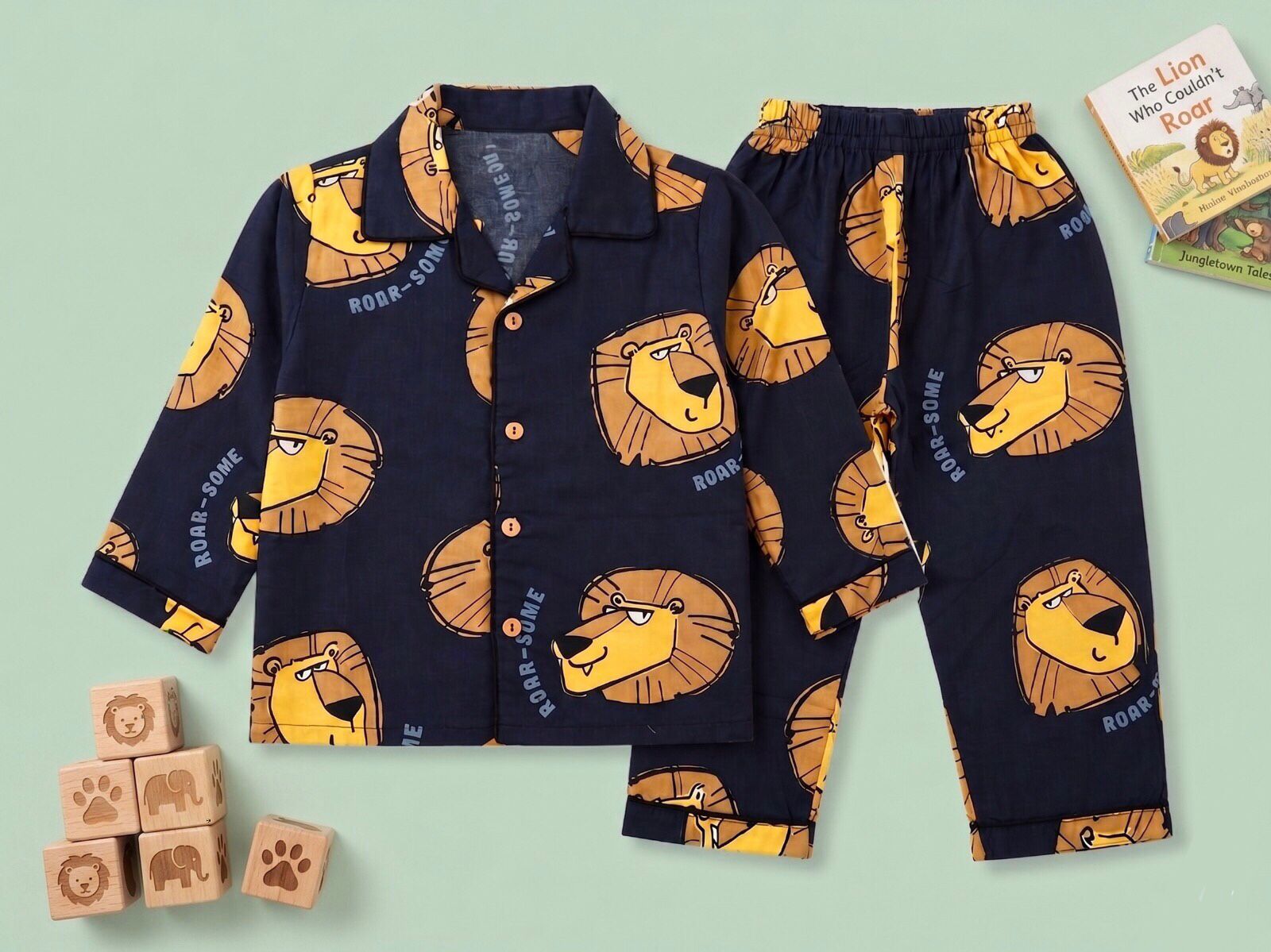 Boys navy blue cotton lion print night suit – front view on child